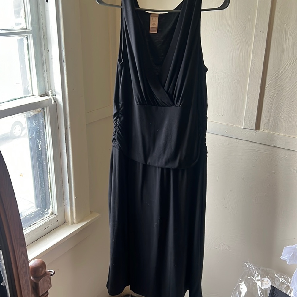 Long elegant legs sleeveless black dress.  Size large. Stretchy